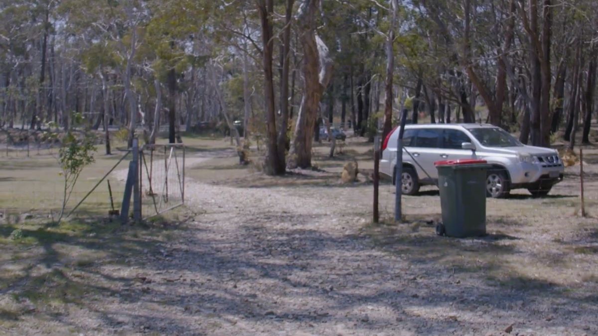 Looking at the gate to see if it’s wide enough for firefighting vehicles.